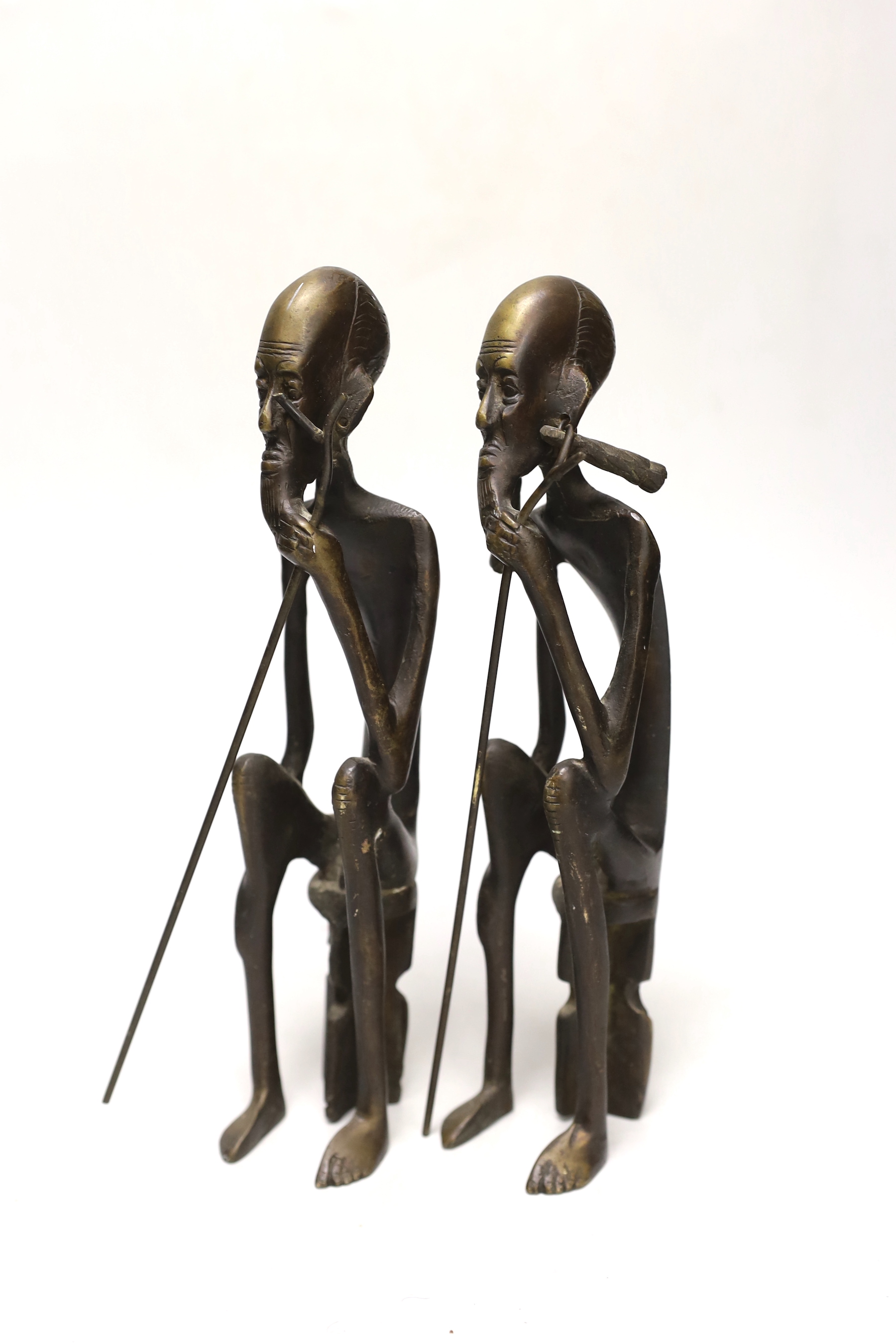 A pair of African figural bronzes, 27cm high